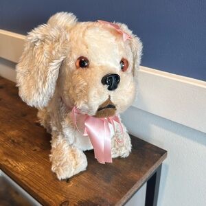 Vintage Dog Plush Stuffed Animal stiff with pink bows, hard nose, curly tail
